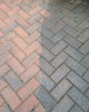 You can see the benefit of pressure washing dirty patio paving